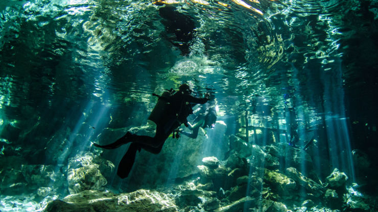 Scuba diver in caves at Tulum, Mexico